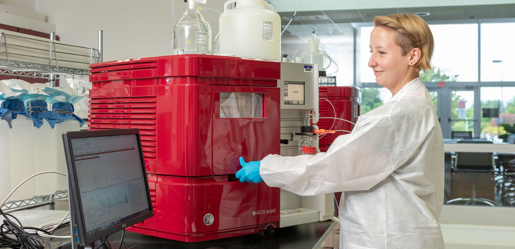 Tech Lab Employee Working on Machine