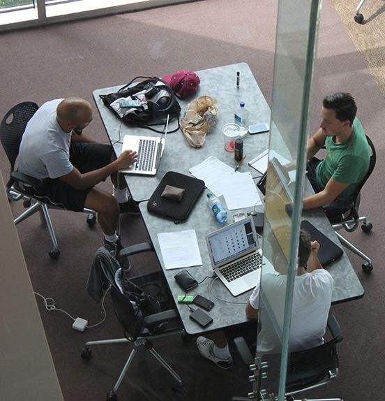 men working at table